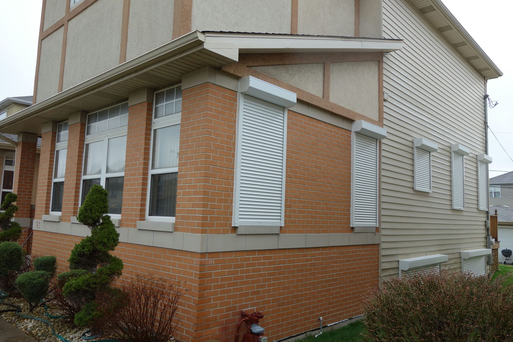 Rolling shutters integrated into a modern building design